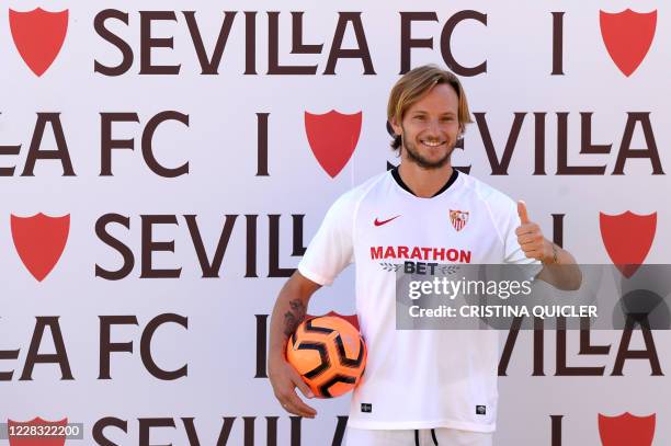 Croatian midfielder Ivan Rakitic poses during his official presentation as new player of Sevilla FC at the Ciudad Deportiva Jose Ramon Cisneros...