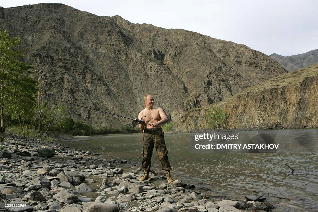 Putin Ping Rave Russian President Vladimir Putin fishes on the Khemchik River near ...