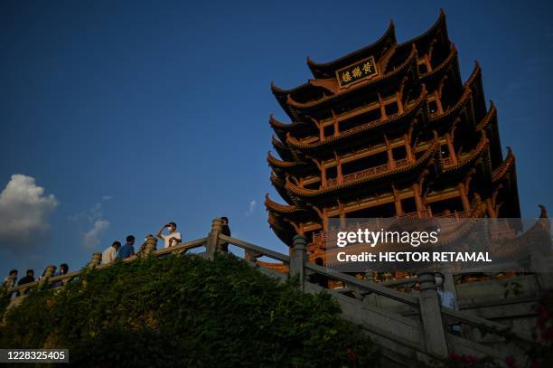 Tourists visit the the Yellow Crane Tower in Wuhan, China's central Hubei province photographed on September 3 during a media visit organised by...