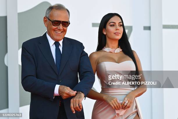 Director of the Venice Film festival, Alberto Barbera and Argentinian-Spanish model and actress Georgina Rodriguez arrive for the screening of the...