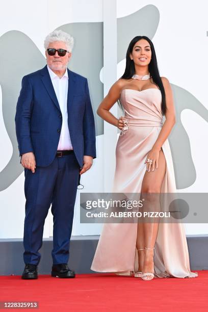 Spanish director Pedro Almodovar and Argentinian-Spanish model and actress Georgina Rodriguez arrive for the screening of the film "The Human Voice"...