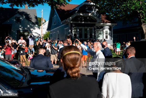 Democratic presidential candidate Joe Biden waves to supporters as he departs an event in Wauwatosa, Wisconsin on September 3, 2020. - Joe Biden met...