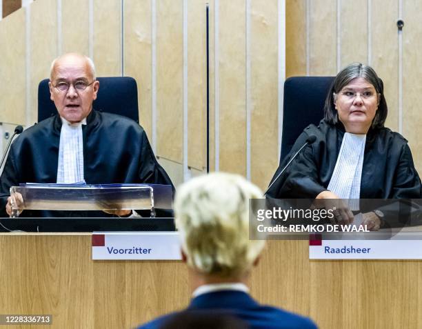 Judge JM Reinking and Dutch far-right Freedom Party Geert Wilders sit in the court of appeal in The Hague, during the court's ruling in the 2014...