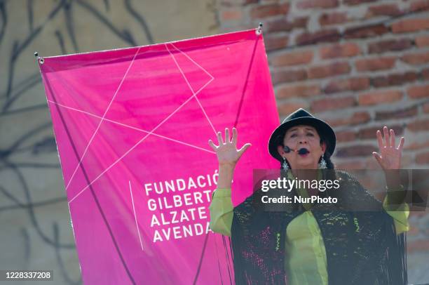 Performer chants stories to diners at el Chorro de Quevedo as part of the pilot to re open restaurants, Bogota, Open Sky 'Bogota Cielo Abierto' as...