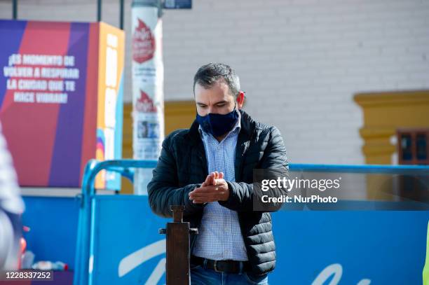 People sanitize their hands and their temperature is taken at el Chorro de Quevedo as part of the pilot to re open restaurants, Bogota, Open Sky...