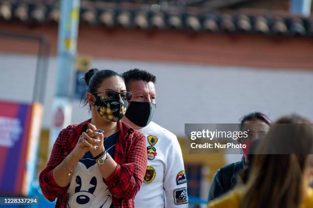 People enjoy a sunny day eating lunch at el Chorro de Quevedo as part of the pilot to re open restaurants, Bogota, Open Sky 'Bogota Cielo Abierto' as...