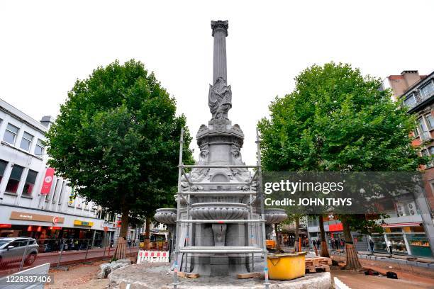 The ornate fountain is covered with scafolding during renovation, in center of Verviers on September 3, 2020. - An ornate fountain in Verviers,...