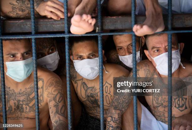 Members of the MS-13 and 18 gangs remain in an overcrowded cell at the Quezaltepeque prison, in Quezaltepeque, El Salvador, on September 4, 2020....