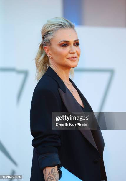 Paola Barale walks the red carpet ahead of the movie &quot;Padrenostro&quot; at the 77th Venice Film Festival at on September 04, 2020 in Venice,...