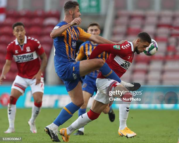 Shrewbury Town's Brad Walker in action with Middlesbrough's Marcus Browne during the Carabao Cup match between Middlesbrough and Shrewsbury Town at...