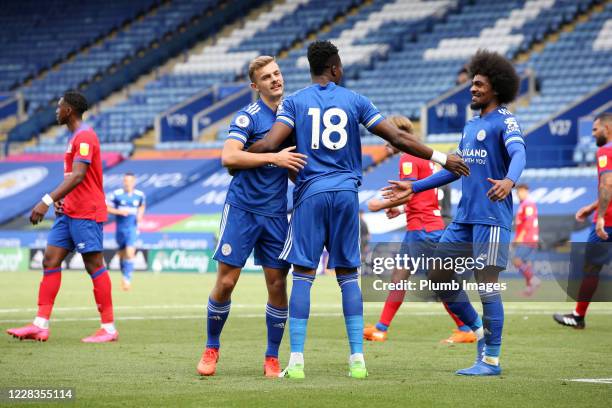 Daniel Amartey of Leicester City celebrates with Kiernan Dewsbury-Hall of Leicester City and Hamza Choudhury of Leicester City after scoring to make...