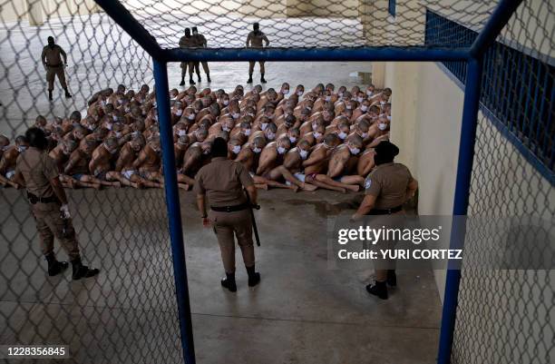 Members of the "Mara 18" and "MS-13" gangs are seen in custody of guards at a maximum security prison in Izalco, Sonsonate, El Salvador on September...