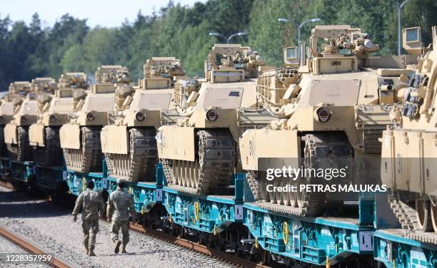 Army Abrams tanks of the 2nd Brigade 69th Regiment 2nd Battalion are pictured at Mockava railway station in Lithuania, on September 5, 2020. -...
