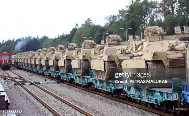 Army Abrams tanks of the 2nd Brigade 69th Regiment 2nd Battalion are pictured at Mockava railway station in Lithuania, on September 5, 2020. -...