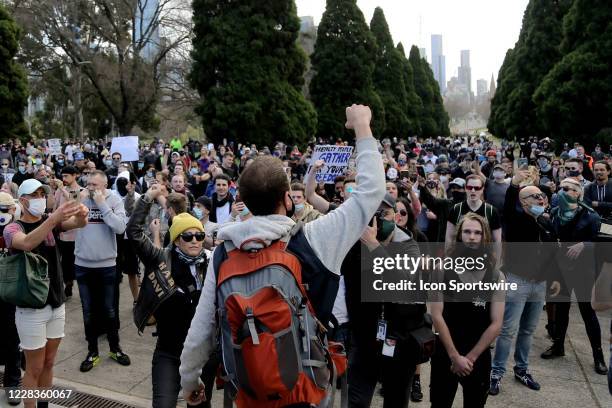 Protesters are seen waving their arms in the air during the Anti-Lockdown Protest on September 05, 2020 in Sydney, Australia. Stage 4 restrictions...