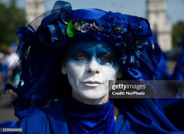 Extinction Rebellion activists dressed in blue gowns take part in the &quot;wave of sadnesses&quot; during the great march for climate change on...