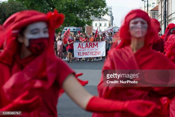 Red Rebel Brigade activists are seen ahead of the great march for climate on September 5, 2020 in Warsaw, Poland. A few thousand people took the...