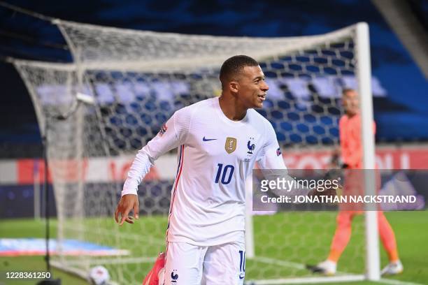 France's forward Kylian Mbappe celebrates scoring the opening goal during the UEFA Nations League football match between Sweden and France on...