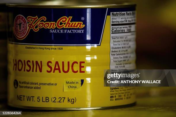 In this picture taken on August 27 a printed label which reads ÒMade in ChinaÓ is used to cover ÒMade in Hong KongÓ labeling on a tin of sauce...