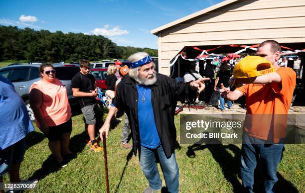 Former Rep. Ben Cooter Jones speaks with fans as he leaves the stage after performing with Cooters Garage Band during his birthday celebration at...