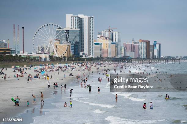 People enjoy the beach on September 5, 2020 in Myrtle Beach, South Carolina. The Labor Day weekend marks an end to a Covid-19 hampered summer tourist...