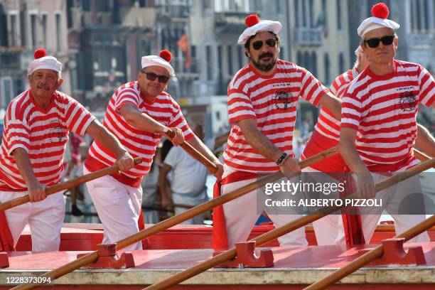 Rowers take part in the annual traditional gondolas and boats Historical Regatta on the Grand Canal in Venice on September 6, 2020 during the...
