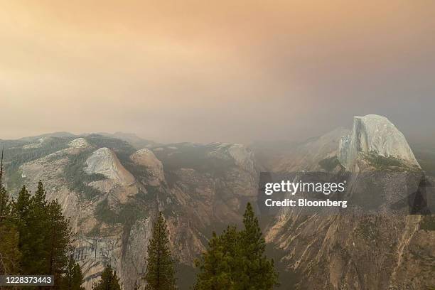 Best quality available. Image was created with a smartphone.) Smoke from the Creek Fire settles over Half Dome and Glacier Point in Yosemite National...