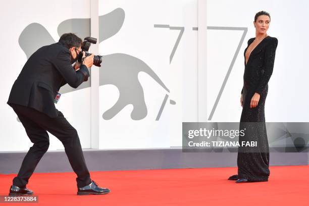 Photographer takes photos of Master of Ceremonies and sponsor of the festival, Italian actress Anna Foglietta as she arrives for the screening the...