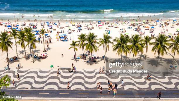 An aerial view of people enjoying the weather at Copacabana Beach on September 6, 2020 in Rio de Janeiro, Brazil. Residents of Rio de Janeiro and...