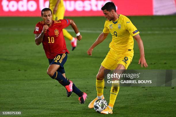 Spain's midfielder Thiago Alcantara challenges Ukraine's forward Roman Yaremchuk during the UEFA Nations League A group 4 football match between...