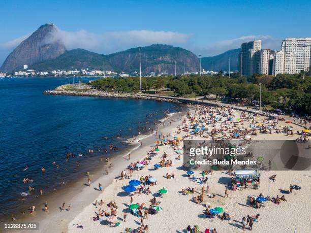 An aerial view of people enjoying the weather at Flamengo Beach on September 6, 2020 in Rio de Janeiro, Brazil. Residents of Rio de Janeiro and...
