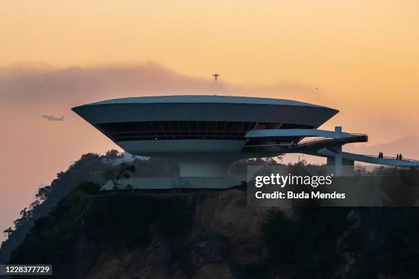 General view at the Museum of Contemporary Art with the statue of Christ the Redeemer at the background on September 6, 2020 in Niteroi, Brazil....