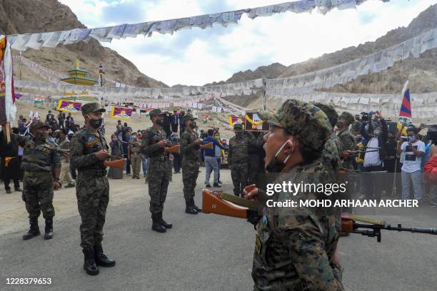 Indian soldiers pay their respects during the funeral of their comrade, Tibetan-origin India's special forces soldier Nyima Tenzin in Leh on...