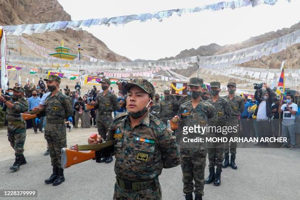 Indian soldiers pay their respects during the funeral of their comrade, Tibetan-origin India's special forces soldier Nyima Tenzin in Leh on...