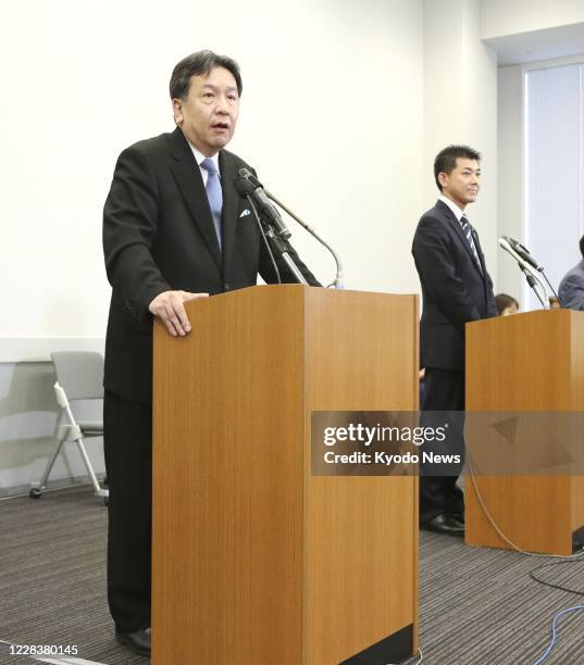 Yukio Edano , head of the Constitutional Democratic Party of Japan, and Kenta Izumi, policy chief of the Democratic Party for the People, attend at a...