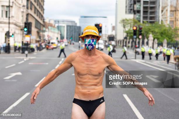 Protester dressed in swimming trunks takes part during the demonstration. The groups of Extinction Rebellion Marine, Ocean Rebellion, Sea Life...