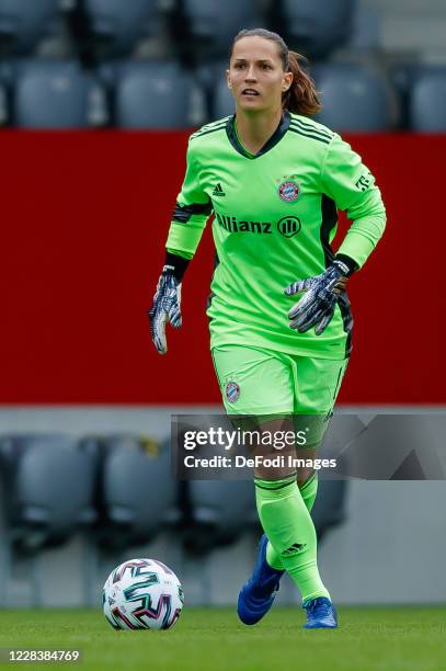 Goalkeeper Laura Benkarth of Bayern Muenchen controls the ball during the Flyeralarm Frauen Bundesliga match between FC Bayern Muenchen Women and SC...