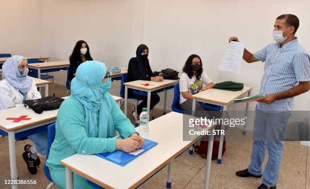 Students attend the first day of classes amid measures put in place by Moroccan authorities in bid to stop the spread of Covid-19, in the city of...