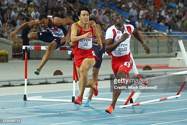 Xiang Liu of China and Dayron Robles of Cuba compete during the men's 110 metres hurdles final during day three of the 13th IAAF World Athletics...