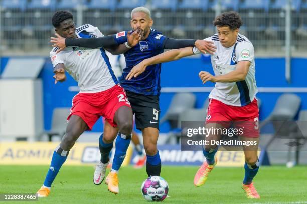 Amadou Onana of Hamburger SV, Matheus Cunha of Hertha BSC and Aaron Opoku of Hamburger SV battle for the ball during the pre-season friendly match...