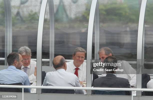 German Foreign Minister Guido Westerwelle and French Foreign Minister Alain Juppe hold talks on a boat on the Spree river on August 29, 2011 in...