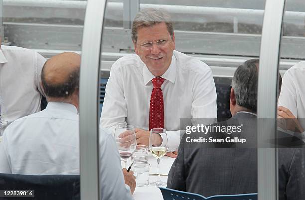 German Foreign Minister Guido Westerwelle and French Foreign Minister Alain Juppe hold talks on a boat on the Spree river on August 29, 2011 in...