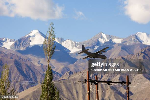 An Indian Air Force Hercules military transport plane prepares to land at an airbase in Leh, the joint capital of the union territory of Ladakh...