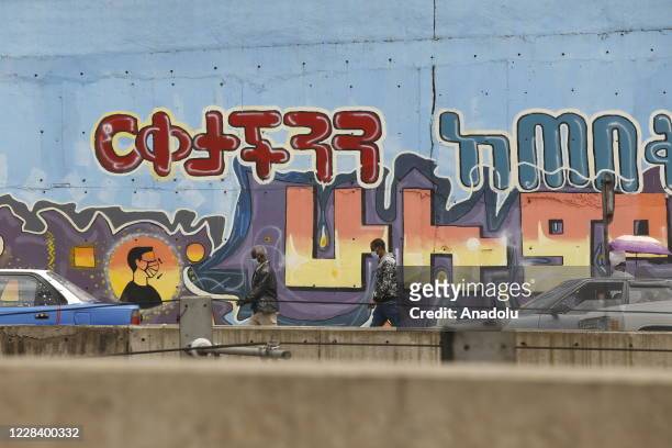 Grafittis painted to raise the awareness of public on coronavirus are seen on a wall in Addis Ababa, Ethiopia on September 08, 2020.