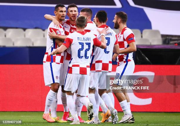 Croatia's defender Dejan Lovren celebrates with team mates after scoring a goal during the UEFA Nations League Group C football match between France...