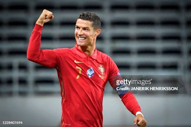Portugal's forward Cristiano Ronaldo celebrates scoring the opening goal, his 100th goal for Portugal, during the UEFA Nations League football match...