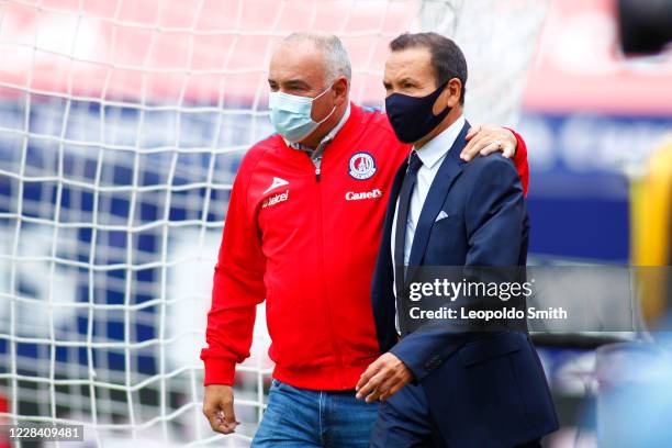 Guillermo Vazquez and Jose Guadalupe Cruz, coaches of Atletico San Luis and Necaxa talk prior the 9th round match between Atletico San Luis and...