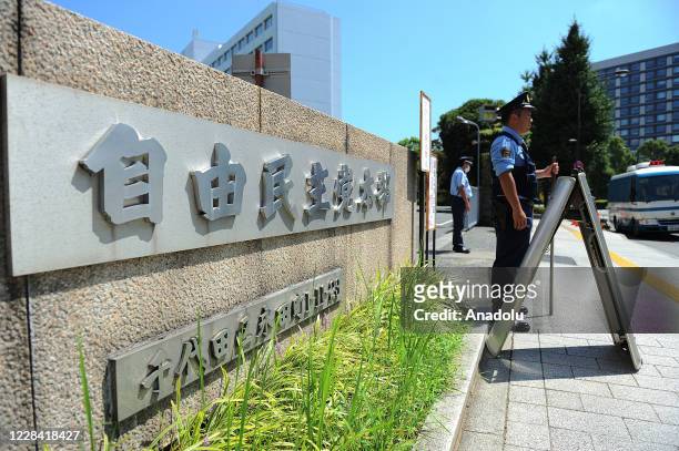 Police officers stand at the entrance of the headquarters of the Liberal Democratic Party in Tokyo, Japan, on September 09, 2020. Japanese Chief...