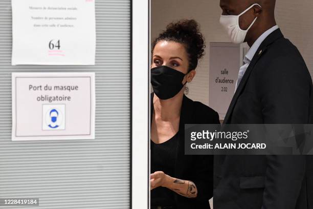 French cartoonist Corinne Rey, also known as 'Coco', looks on at the Paris courthouse in Paris, on September 9 during a hearing of the trial of 14...