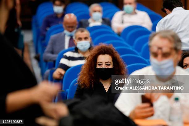 Rosa Maria Esilio , widow of Italian Carabinieri paramilitary police officer Mario Cerciello Rega, waits prior to the start of a hearing at the...